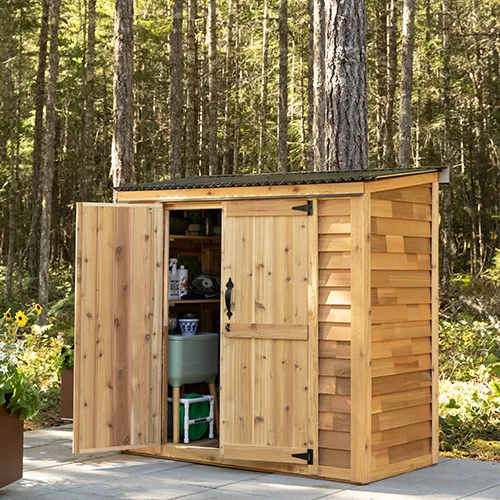 Wooden garden shed in forest setting