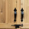 Wooden doors with black metal handles