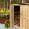 Cedar shed with open doors, flowers.