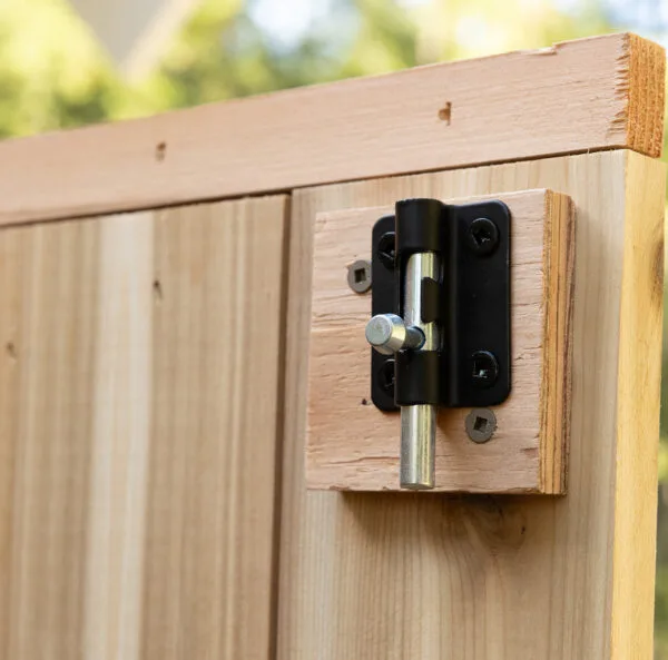 Close-up of wooden shed hinge