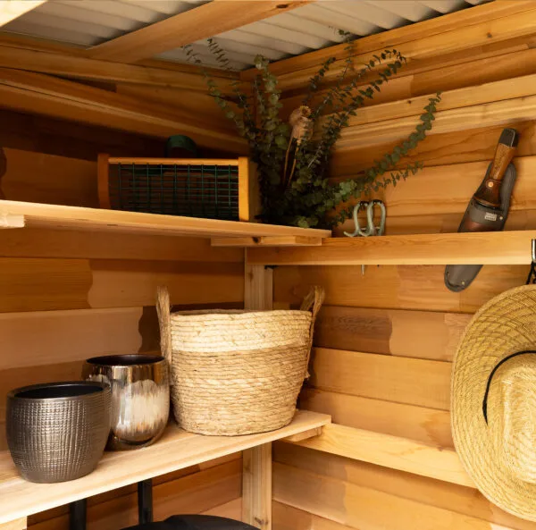 Wooden shed interior with organized storage.