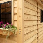 Wooden shed with flower box.