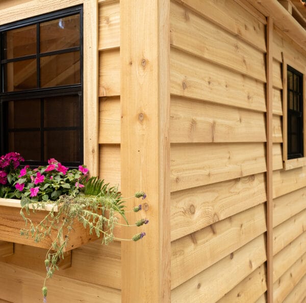 Wooden shed with flower box.