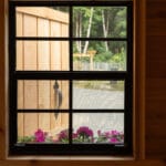 Window view with flowers and door