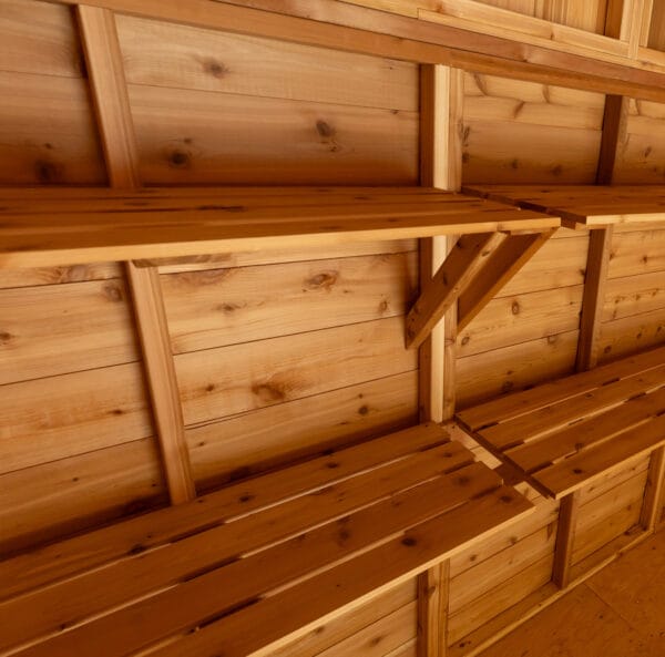Wooden shelves on a cedar ceiling.