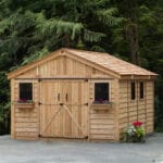 Wooden shed surrounded by greenery