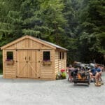Wooden shed surrounded by nature.