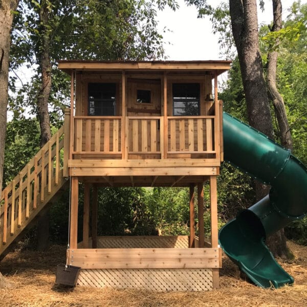 Wooden playhouse with slide and stairs