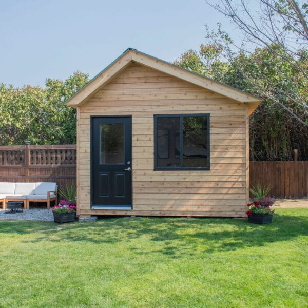 12×8 Saltbox Studio — Western Red Cedar Modern Outdoor Office 2 Modern wooden shed in green yard.