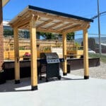 Wooden gazebo with outdoor grill