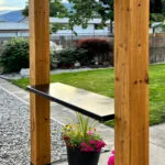 Wooden structure with flowers and table