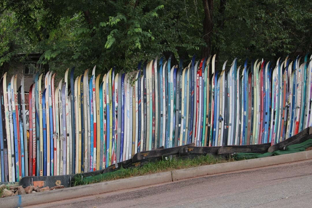A fence made of colorful old skis.