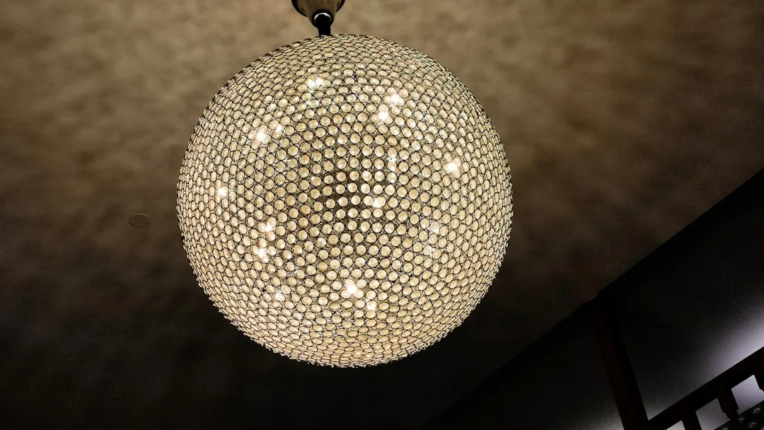 A chandelier hanging from a ceiling in a room