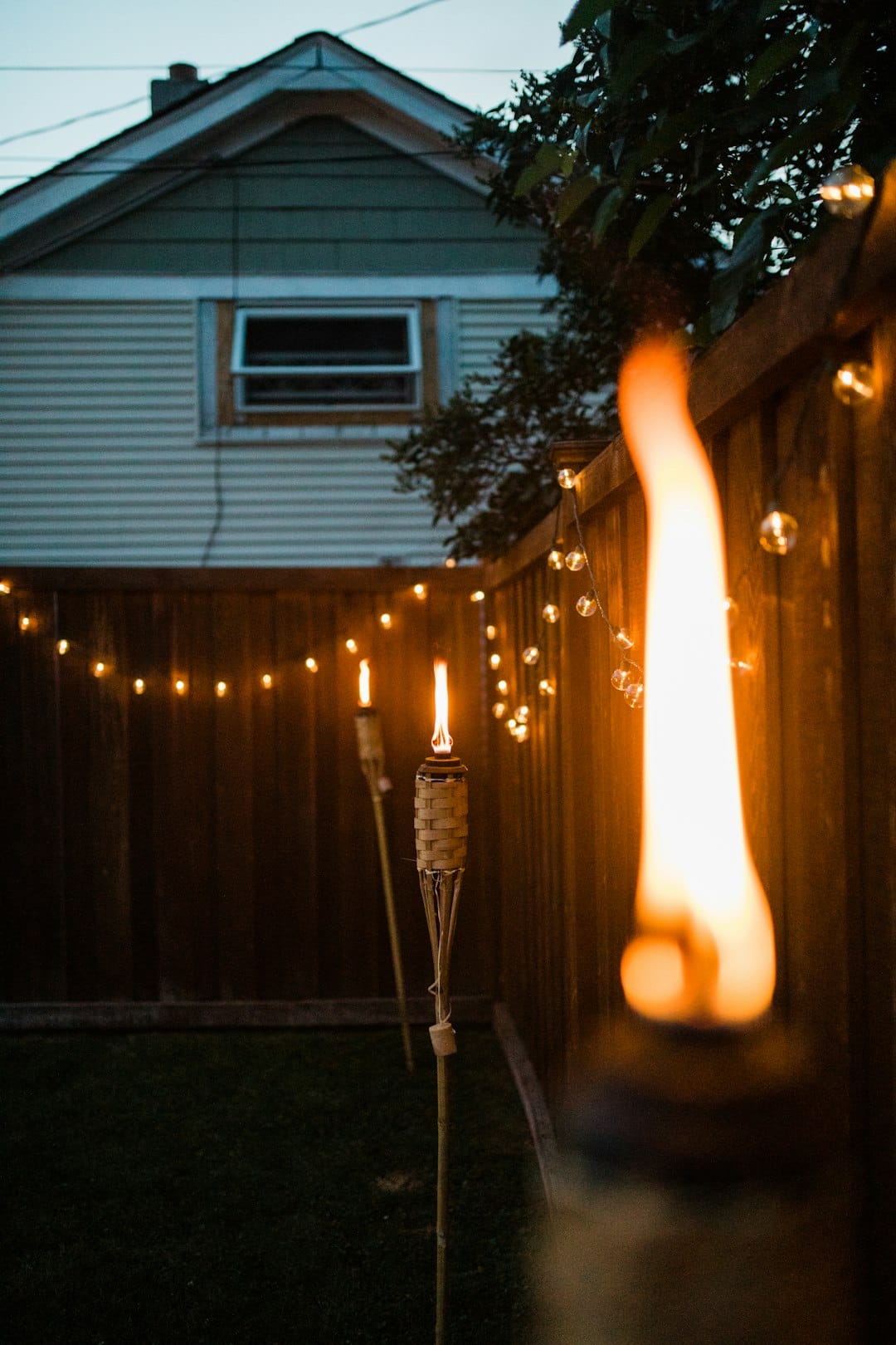 Photo by Lee Vue lighted candles on street during night time